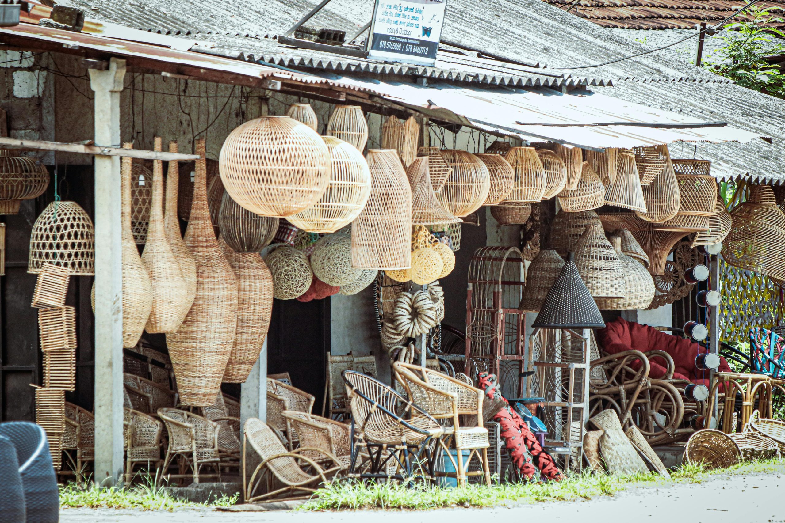 Explore the vibrant display of handmade wicker and rattan crafts at the Weweldeniya market.